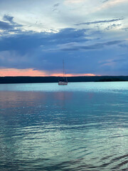 Obraz premium photo of sunset on the river, in artistic processing, unrealistic