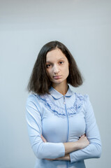 Obraz premium Portrait of a young office worker a girl in a blue shirt