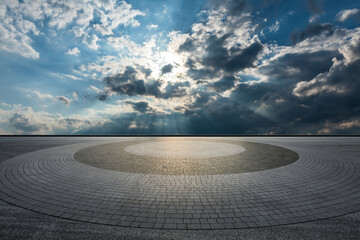 Empty square floor and cloudy sky scene.