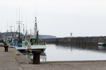Fishing boats in Japan at the port, Japanese fishing vessels in a marina. Boats at the dock.