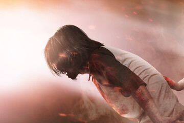 Scary zombie with blood and wound on his body walking