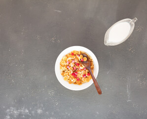 Mini pancake cereal with redcurrant berries nuts and milkfor breakfast. Mini pancake cereal is new trend. Mini pancakes cereal served for breakfast