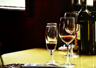 Red wine in clear wine glass ready to eat or serve for customer. Luxury red wine for rich people place on wooden table decoration in classic and luxury style.