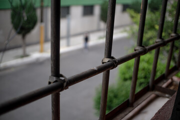 window seeing freedom through bars, stay at home