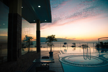 Sunset view to lake Toba from the pool