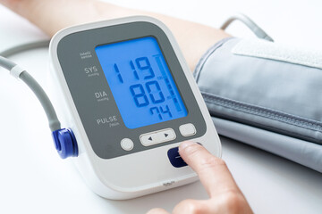 Man check blood pressure monitor and heart rate monitor with digital pressure gauge. Health care...