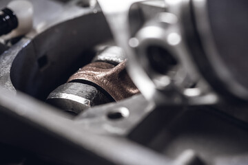 Chainsaw engine parts. Cylinder, piston, rings, pin, spark plug. Garden equipment service and repair