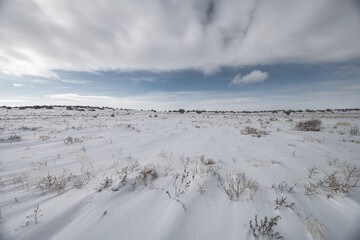 Fototapeta na wymiar Snow on field of plateau 
