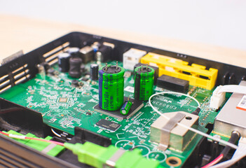Close up of Electrolytic capacitor row with various sizes place on electronic circuit board