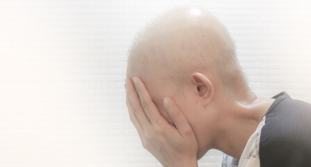 Soft focus of woman's hair loss resulting from chemotherapy. Side effects from breast cancer. with...