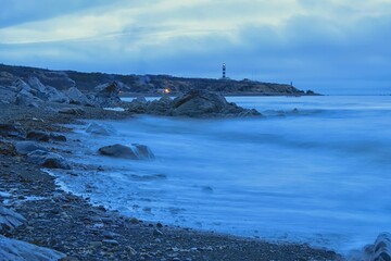 Lighthouse shining on the Marekan Cape. Sea of Okhotsk coast. Khabarovsk region, far East, Russia.