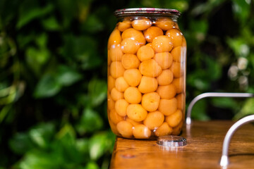 Jar of cherry plum compote close view