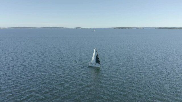 Sailboat sailing in the middle of the sea. Sailing boat in the archipelago.