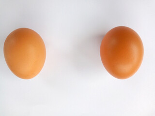 2 separate eggs on a white background
