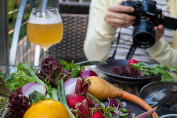 Professional food blogger taking blog photos at a restaurant