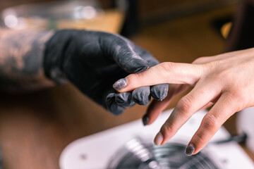 Close-up automatic electric manicure drill polish remover for nail women. Nail, gel polish and beauty salon concept.