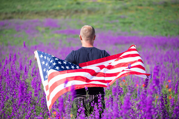  Patriot man holding the american flag on the 4th of July