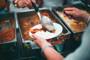 The hands of the beggars, who were helped by volunteers : The concept of poverty