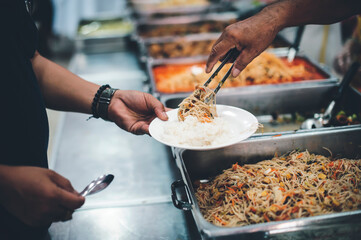 The hands of the beggars, who were helped by volunteers : The concept of poverty