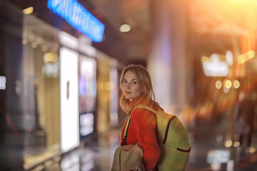 tourist girl with a backpack at the station, spring trip