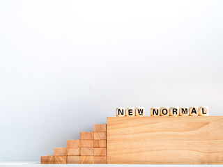 New Normal, words on wooden alphabet cube.