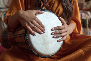 the girl's hands play a beautiful melody on an African drum. meditation