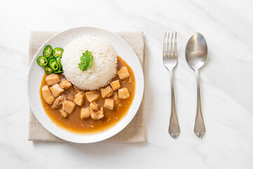 Chicken in brown sauce or gravy sauce with rice