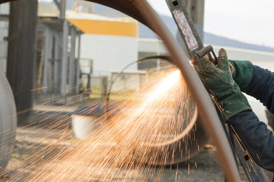 Worker Is Cutting Pipe Material With Oxy Acetylene. Oxy-fuel Welding (oxyacetylene Welding, Oxy Welding, Or Gas Welding In The U.S.) And Oxy-fuel Cutting Are Processes That Use Fuel Gases.