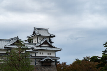 Kanazawa Castle with cloudy dark sky background in Kanazawa, Japan, autumn
