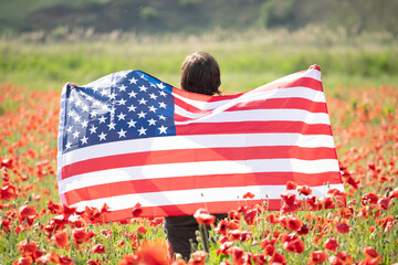 Patriot woman holding the american flag on the 4th of July