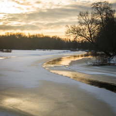 river in winter with ice and snow