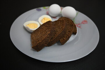 Eggs and bread on a white plate