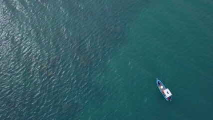 Aerial static lock down view to the boat on a water surface