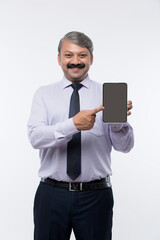 Businessman presenting a digital tablet with a blank display 