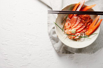 Salmon sashimi and imitation crab stick in Japanese style with kimchi, wasabi.