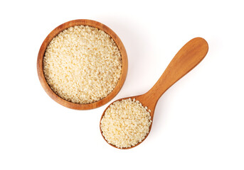 Sesame seed in wooden spoon and brown wooden bowl
