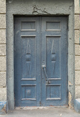 an old dark gray wooden door