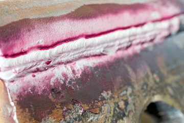 View of the longitudinal crack in the heat affected zone (top welding edge) with liquid penetrant...