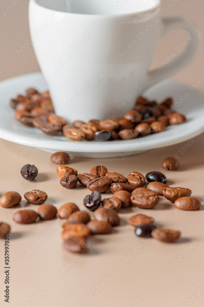 Wall mural roasted coffee beans and cup with copyspace. roasted coffee beans of the morning mood.