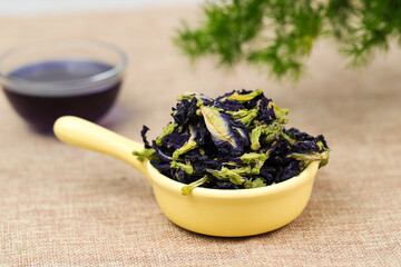 Purple butterfly flowers were placed in a dish