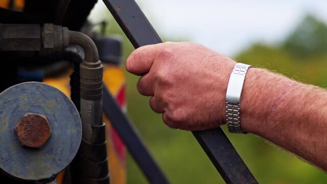 Truck Driver Climbing Stairs Grabbing Railing Hand Close Up Tree Logging