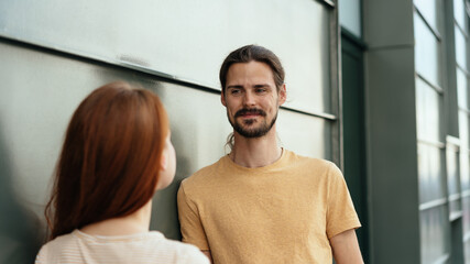 Fototapeta na wymiar Attractive man chatting to a young woman