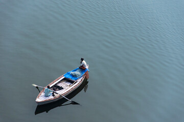 Obraz premium Top view of boats are being sailed on the river ganges of Varanasi. Indian lifestyle, travel and tourism