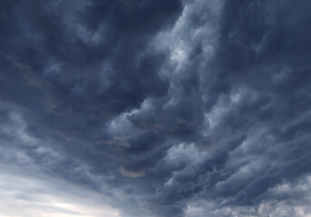 Blue and gray dramatic mammatus pre-thunderstorm clouds