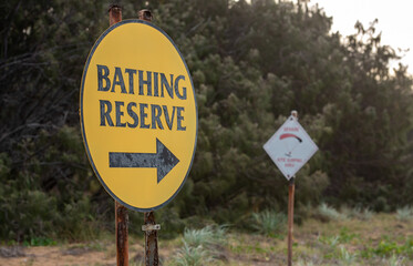 corroded bathing reserve sign on Tannum Sands beach, Gladstone Region, Queensland