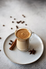 Dalgona coffee. Iced fluffy creamy whipped trend drink with coffee foam and milk. Trendy drink during Covid-19 city lock down and self quarantine, stay at home concept.