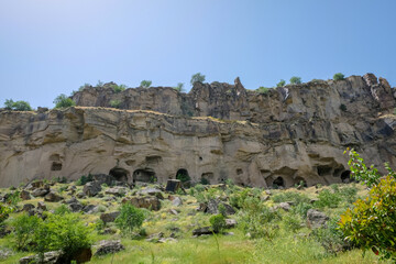 Fototapeta premium Cave town and rock formations in Zelve valley, Cappadocia, Anatolia, Turkey. Goreme national park.