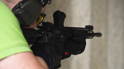 Man Shooting with a rifle on a shooting range.