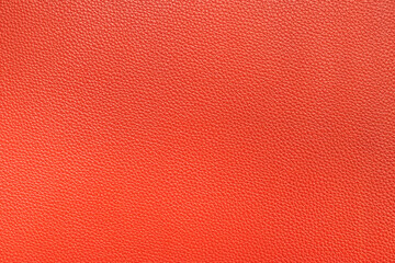 Natural red leather texture, useful as a background. Color luxury fabric with pattern rough cloth surface. Weathered antique grain animal.