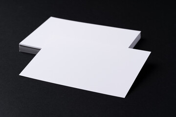 White blank business cards on dark black background